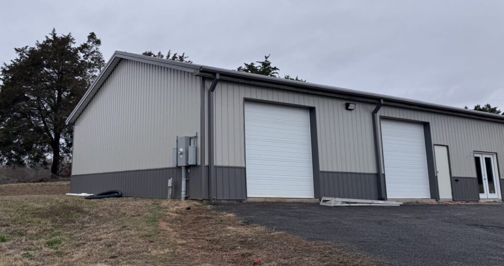 Image of metal building construction on a hill